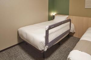 Iroha Grand Hotel Matsumoto Eki-Mae客房内的一张或多张床位