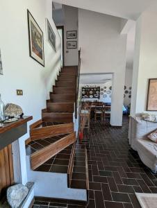 a staircase in a house with a living room at Villa Tiziana R1673 in Is Traias