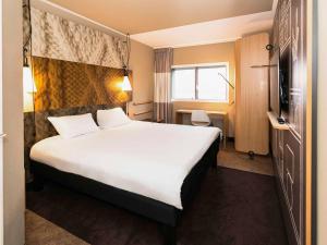 Łóżko lub łóżka w pokoju w obiekcie ibis Amsterdam Centre