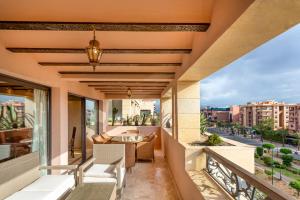 a balcony with a view of a city at Appartement de luxe Hivernage Gueliz in Marrakesh