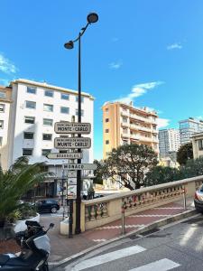 a street sign with many street signs in a city at Monaco Home just 200 mt from Casinò Monte Carlo in Monte Carlo