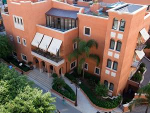 an overhead view of a large orange building at Artemis Hotel in Cefal&ugrave;