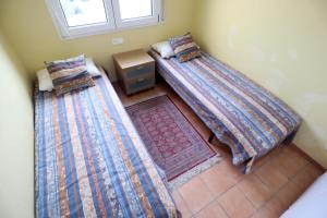 Posteľ alebo postele v izbe v ubytovaní Amplio Apartamento Bahia II