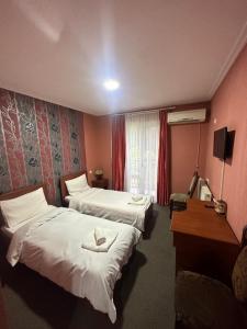 Postel nebo postele na pokoji v ubytování Park Hotel Imeri kutaisi + 24 fotografií