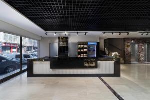 a hair salon with a black and white counter at Pianoforte by Febor Hotels&Spa in Istanbul
