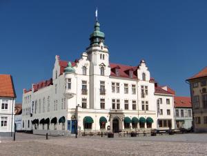 a large white building with a tower on top of it at ProfilHotels Calmar Stadshotell in Kalmar