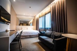Voodi või voodid majutusasutuse Artinn藝築文旅-台北站前館 toas