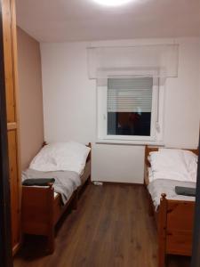 Postel nebo postele na pokoji v ubytování Mátrai5Vendégház