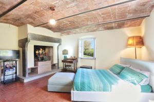 Postel nebo postele na pokoji v ubytování Baciano Azienda Agrituristico Venatoria