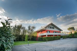 a large red building with a driveway at lepini suites affittacamere in Patrica