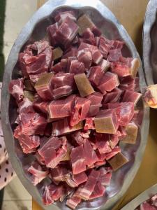 a pile of meat in a bowl on a table at Khách Sạn Hà Phương in Ninh Binh