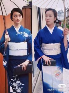 een vrouw in een blauwe kimono met een paraplu bij 京町屋 京都*缘屋kyoto*Enishiya 开业特价&免费早餐供应 NewOpen in Kyoto