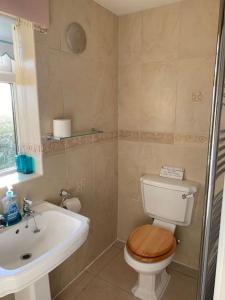 a bathroom with a toilet and a sink at The Bungalow in Preston