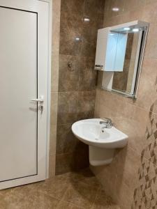 Vonios kambarys apgyvendinimo įstaigoje Апартамент за гости ДИГЕНА