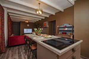 a kitchen with a large island in a room at Boutique Villa Gyula in Gyula