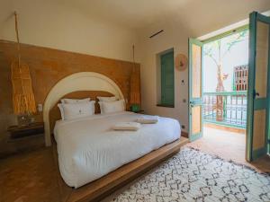 Postel nebo postele na pokoji v ubytování Riad Lalla Mimouna + 37 fotografií