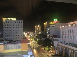 a view of a city at night with buildings at Hoàng Ngân Hotel Phú Yên in Liên Trì (3)
