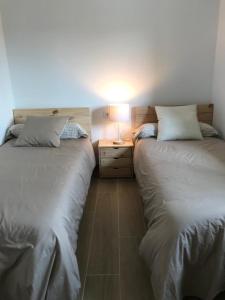 Postel nebo postele na pokoji v ubytování Encantadora casa rural Can Vidal
