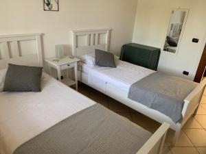 En eller flere senge i et værelse på Casa SoleLuna