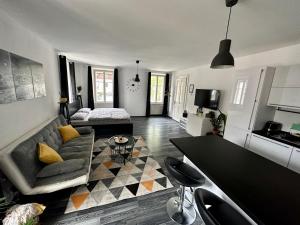 a living room with a couch and a table at Apartment Tina in Bovec