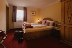 Postel nebo postele na pokoji v ubytování Berghotel Wiedener Eck