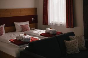 Postel nebo postele na pokoji v ubytování Berghotel Wiedener Eck