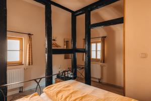 Postel nebo postele na pokoji v ubytování Watzdorfer Geleitschenke und Herberge