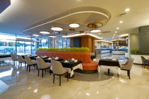 a restaurant with tables and chairs and a bar at Side Stella Elite Resort & Spa - Adults Only in Side