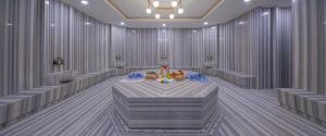 a room with a table with a candle in it at Side Stella Elite Resort & Spa - Adults Only in Side
