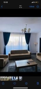 a living room with a couch and a coffee table at Silver Mountain C24 Royal in Poiana Brasov
