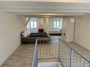 a bedroom with a bed and a staircase in a room at TTP 15 Markdorf in Markdorf
