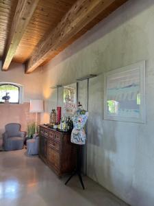 a room with a dresser and a mirror on a wall at Corte Mondina in Gazoldo degli Ippoliti