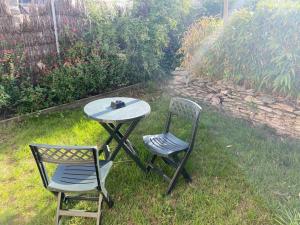 Vonkajšia záhrada v ubytovaní Appartement avec Jardin