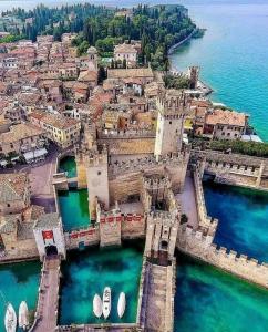 an aerial view of a town next to the water at Casa della Regina in Sirmione
