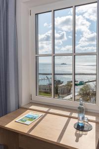 a window with a view of the ocean at Kurhotel Sassnitz in Sassnitz