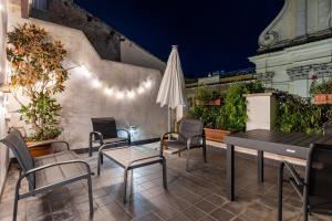 Un patio o zona al aire libre en Navona Open Space Apartments