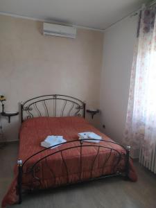 A bed or beds in a room at Villa Rita