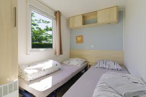 Posteľ alebo postele v izbe v ubytovaní Mobilhome 373 + 17 fotografií