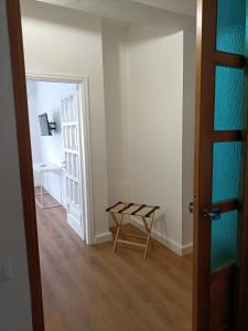 a room with a table and a chair and a door at Casa Teranga in Furore