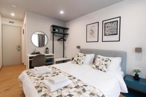 Postel nebo postele na pokoji v ubytování Olvia Suites