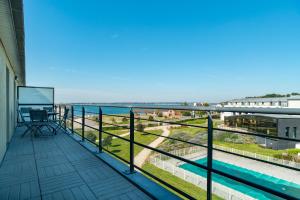 Balkón alebo terasa v ubytovaní Les Thermes 532 - Vue mer avec piscine partagée