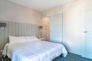 Posteľ alebo postele v izbe v ubytovaní Les Thermes 532 - Vue mer avec piscine partagée
