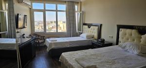 Katil atau katil-katil dalam bilik di Adana Koza Hotel