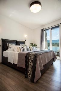 Posteľ alebo postele v izbe v ubytovaní A & B Minimal Suite with Sea View in Argostoli