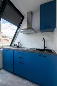 Kuchyň nebo kuchyňský kout v ubytování Olvia Suites