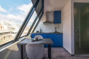 Kuchyň nebo kuchyňský kout v ubytování Olvia Suites