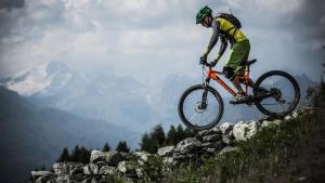 a person doing a trick on a bike in the air at RESIDENCE Rive Droite in La Léchère