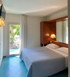 Postel nebo postele na pokoji v ubytování Hotel Pai