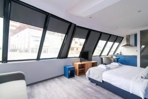 Postel nebo postele na pokoji v ubytování Olvia Suites