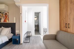 Postel nebo postele na pokoji v ubytování Olvia Suites